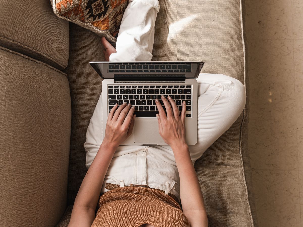 woman writing on laptop